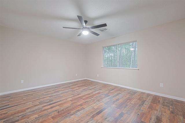 unfurnished room featuring ceiling fan and wood-type flooring