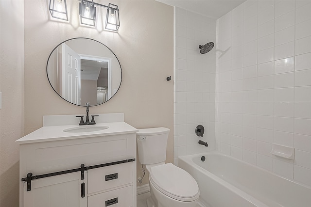 full bathroom with vanity, tiled shower / bath combo, and toilet