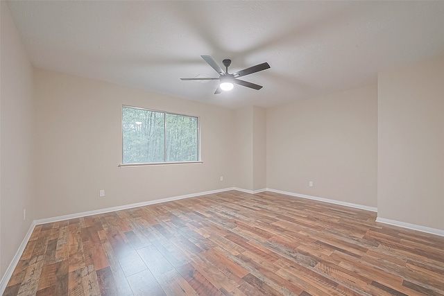 spare room with light hardwood / wood-style floors and ceiling fan