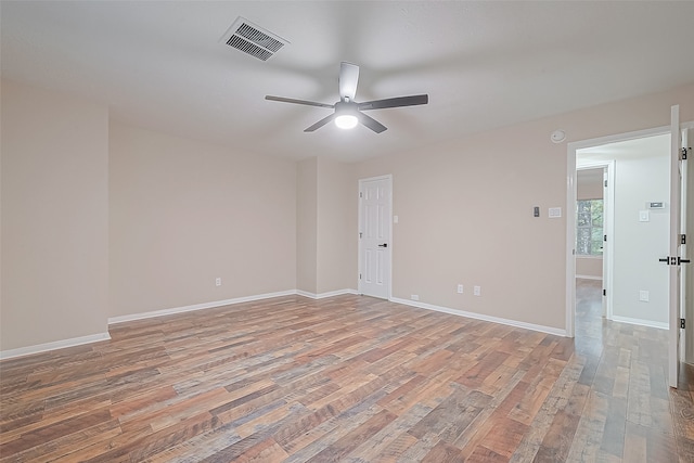 unfurnished room with ceiling fan and light hardwood / wood-style floors