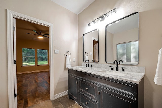 bathroom with ceiling fan, hardwood / wood-style floors, and vanity