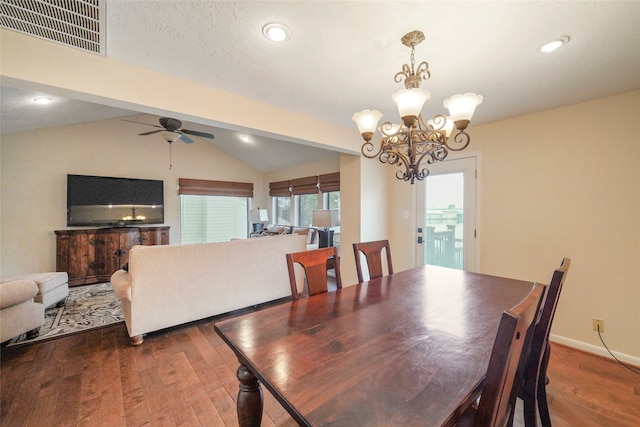 dining area with dark hardwood / wood-style floors, ceiling fan with notable chandelier, and vaulted ceiling