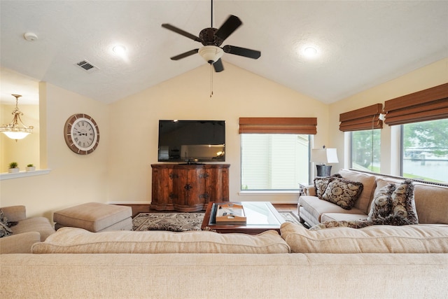 living room with vaulted ceiling, ceiling fan, and wood-type flooring