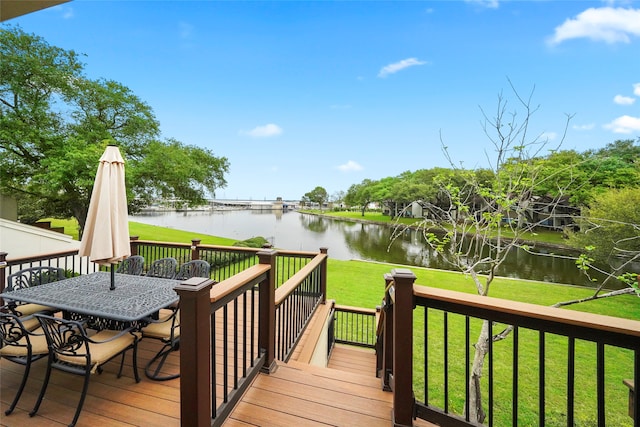 deck featuring a yard and a water view