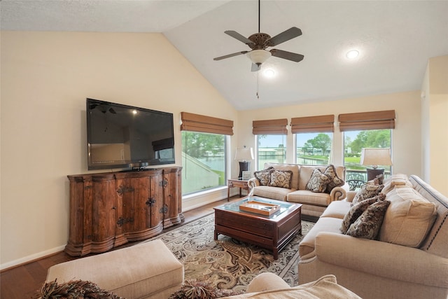 living room featuring high vaulted ceiling, ceiling fan, and dark hardwood / wood-style floors