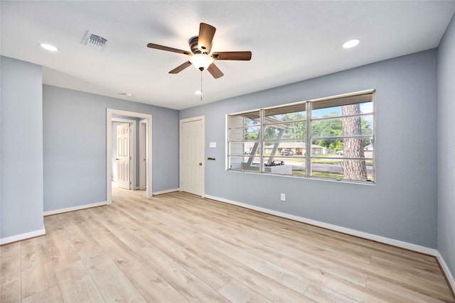 unfurnished room featuring light hardwood / wood-style floors and ceiling fan