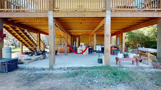 view of home's community featuring a wooden deck and a patio area