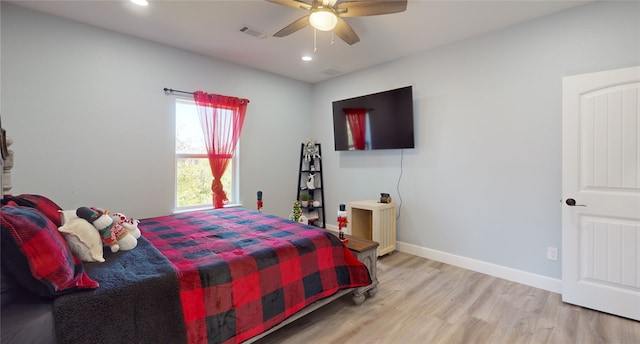 bedroom featuring ceiling fan and light hardwood / wood-style floors