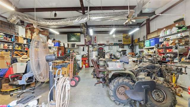 garage featuring a workshop area and ceiling fan