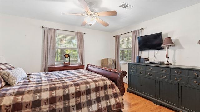 bedroom featuring light wood-type flooring and ceiling fan