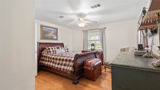 bedroom with light hardwood / wood-style floors and ceiling fan