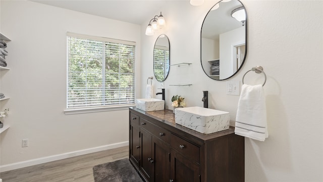 bathroom with hardwood / wood-style floors and vanity