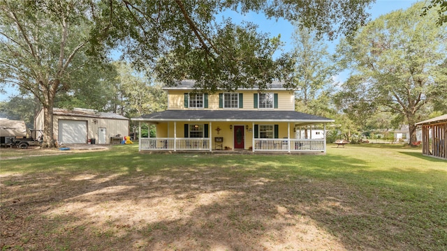 country-style home featuring an outdoor structure, a garage, a front yard, and covered porch