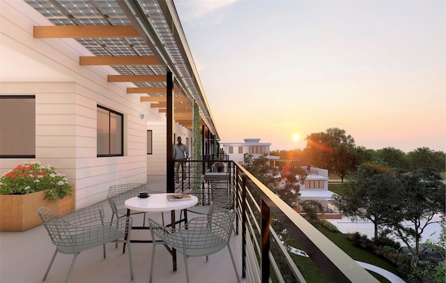 view of balcony at dusk