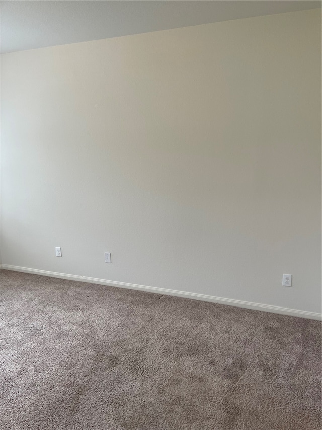 unfurnished room featuring carpet flooring