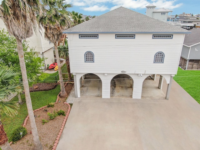 view of front of property with a front lawn and a patio area