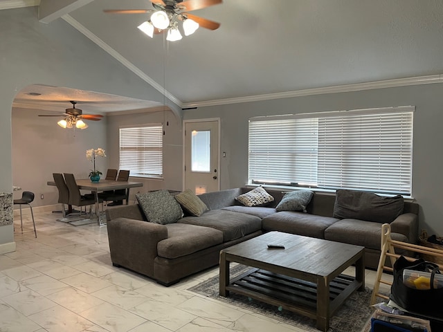 living room with ceiling fan, vaulted ceiling with beams, ornamental molding, and light tile flooring