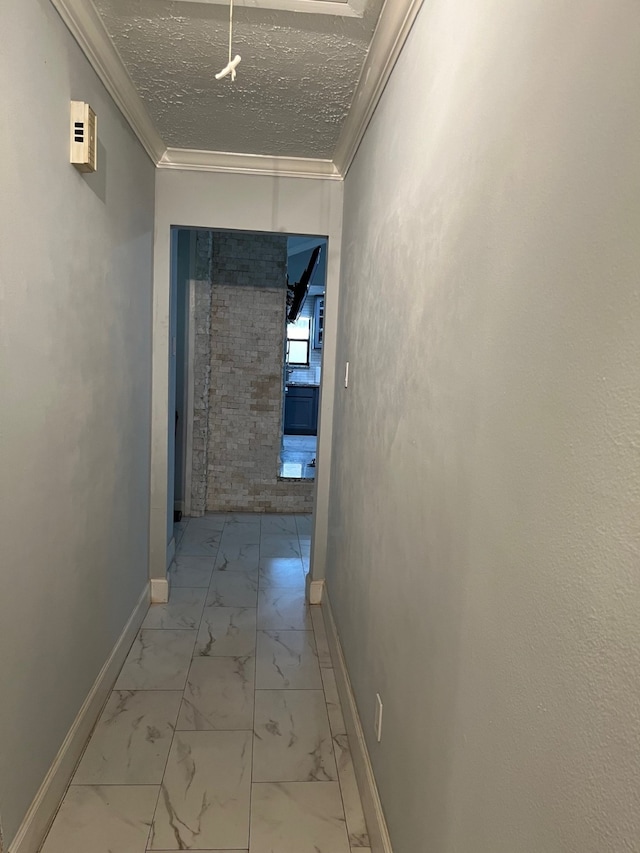 hall with crown molding, a textured ceiling, and light tile flooring