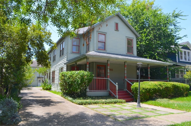 view of front of home with a porch and a garage