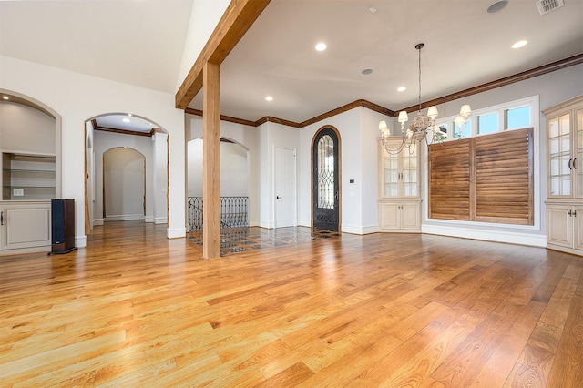 interior space with light hardwood / wood-style floors and a notable chandelier