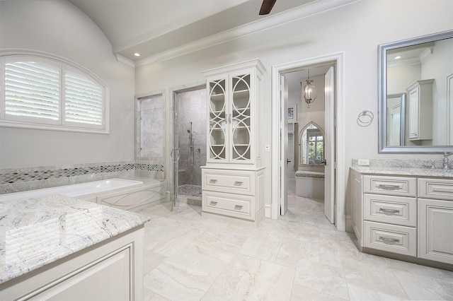 bathroom featuring vanity, a wealth of natural light, lofted ceiling, and shower with separate bathtub