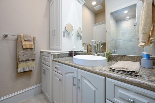 bathroom featuring vanity and an enclosed shower