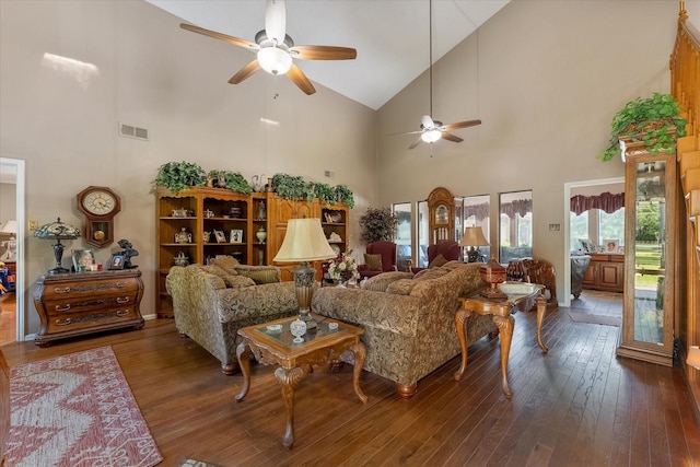 living room with ceiling fan, high vaulted ceiling, and dark hardwood / wood-style flooring