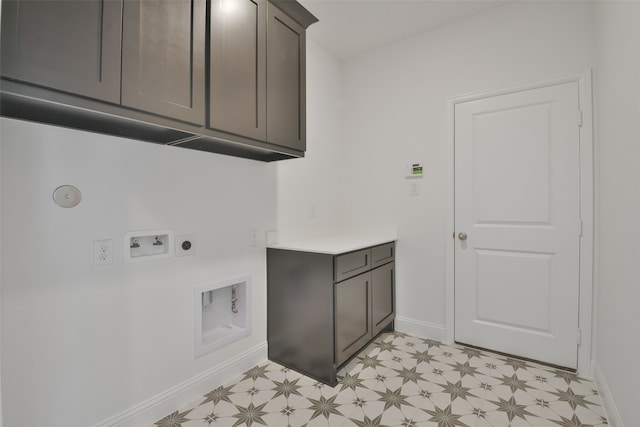 laundry area featuring hookup for an electric dryer, washer hookup, and cabinets