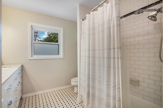 bathroom with toilet, tile flooring, and vanity