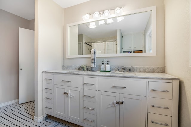 bathroom featuring double sink vanity and tile flooring