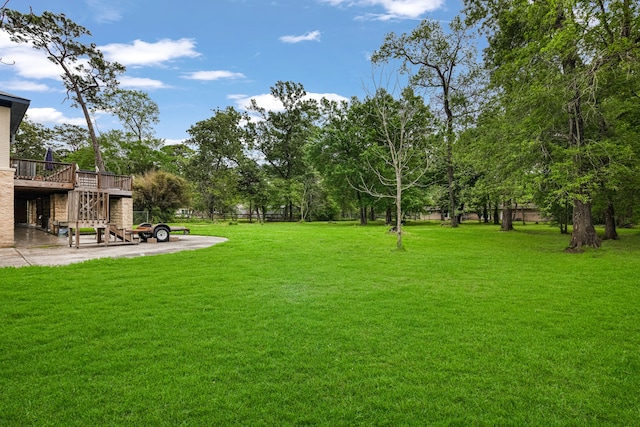 view of yard with a deck