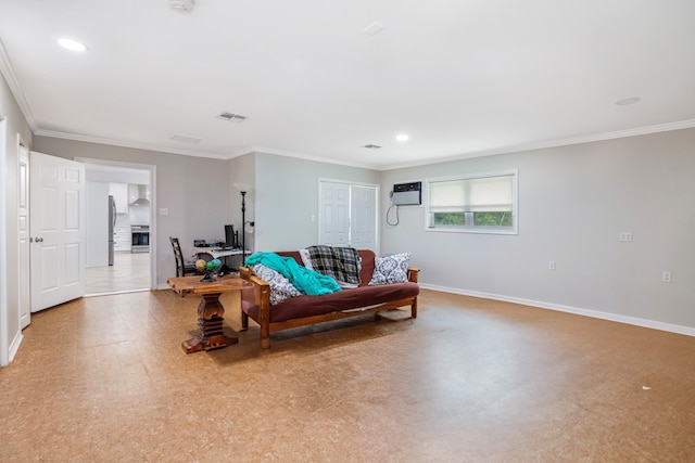 living room featuring ornamental molding and a wall mounted AC