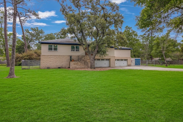 view of front of property with a front lawn and a garage