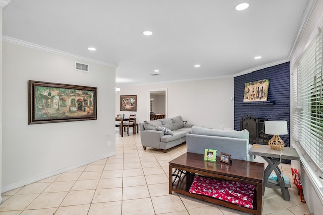 tiled living room with a brick fireplace and ornamental molding