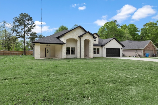 view of front of house featuring a front lawn and a garage