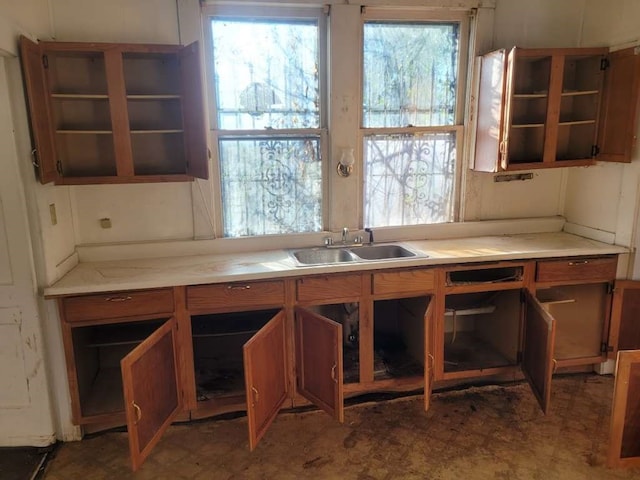 kitchen featuring tile flooring and sink