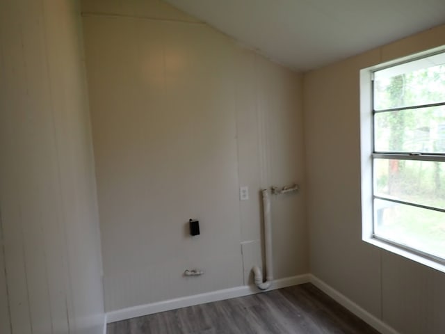 laundry area featuring dark wood-type flooring