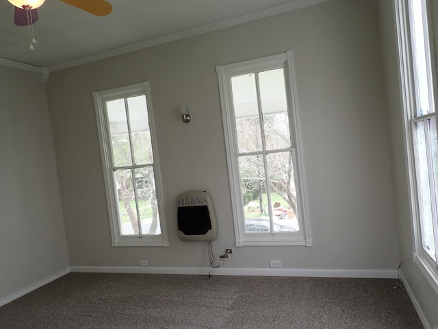 carpeted empty room with crown molding and ceiling fan