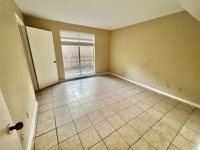 empty room with light tile patterned flooring