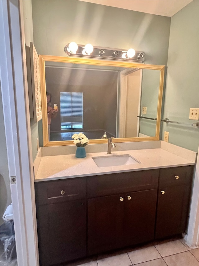 bathroom with tile patterned flooring and vanity