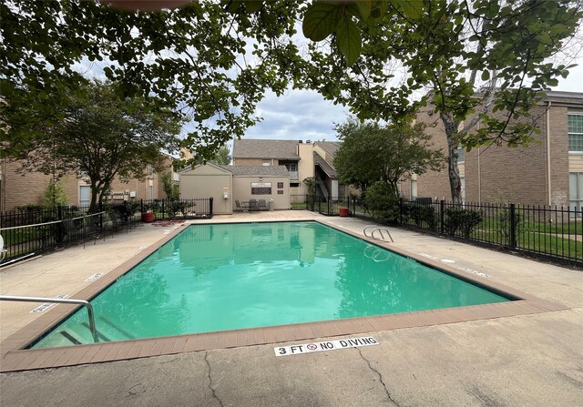 view of swimming pool featuring a patio