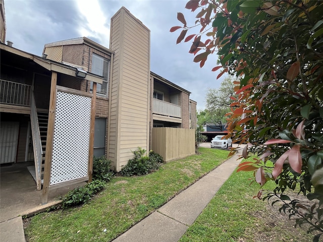 view of property exterior featuring a yard