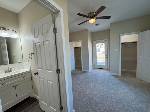 bathroom featuring vanity and ceiling fan