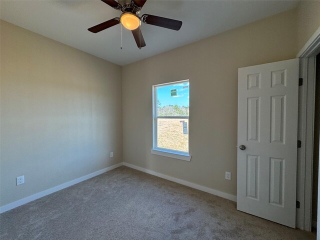 carpeted empty room with ceiling fan