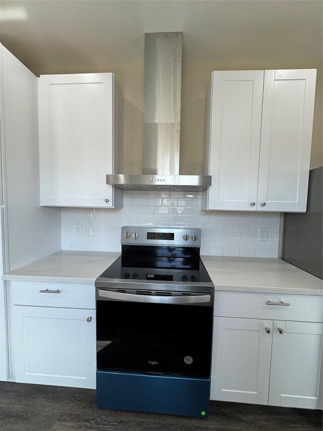 kitchen featuring white cabinetry, stainless steel electric stove, tasteful backsplash, and wall chimney range hood