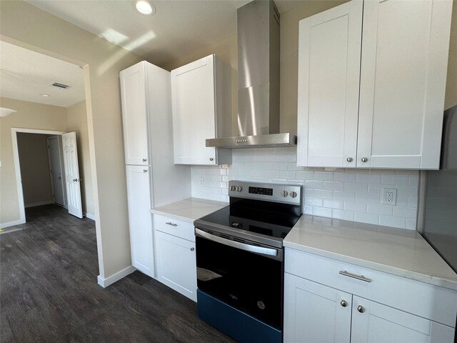 kitchen featuring white cabinets, stainless steel electric range oven, decorative backsplash, and wall chimney range hood