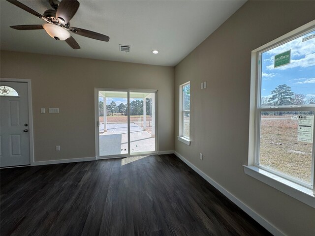 interior space with dark hardwood / wood-style floors and ceiling fan