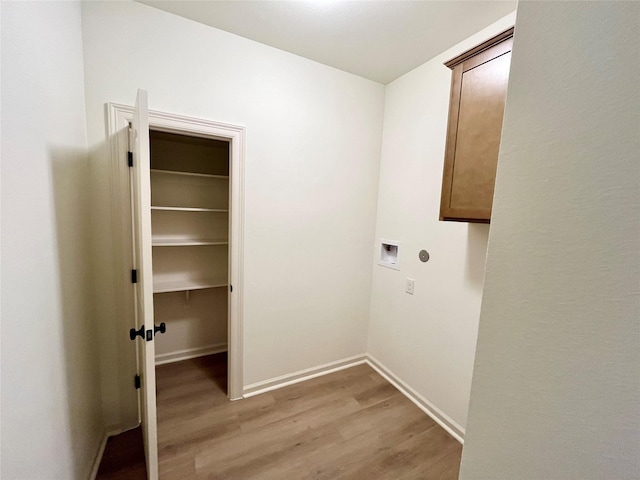 726 Blue Sky Pl, Beasley, TX 77417 - laundry area featuring hookup for a washing machine, light wood-style floors, and baseboards