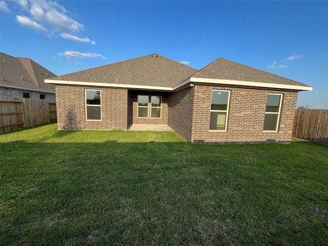 726 Blue Sky Pl, Beasley, TX 77417 - rear view of property with brick siding, a shingled roof, and a patio area