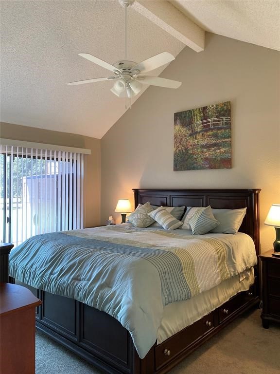 carpeted bedroom featuring a textured ceiling, vaulted ceiling with beams, and ceiling fan